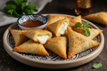 Mini Briwat Fromage - Moroccan crispy golden pastry triangles filled with melted creamy cheese