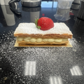 Classic French Napoléon Mille-Feuilles with puff pastry, vanilla cream and fresh strawberry